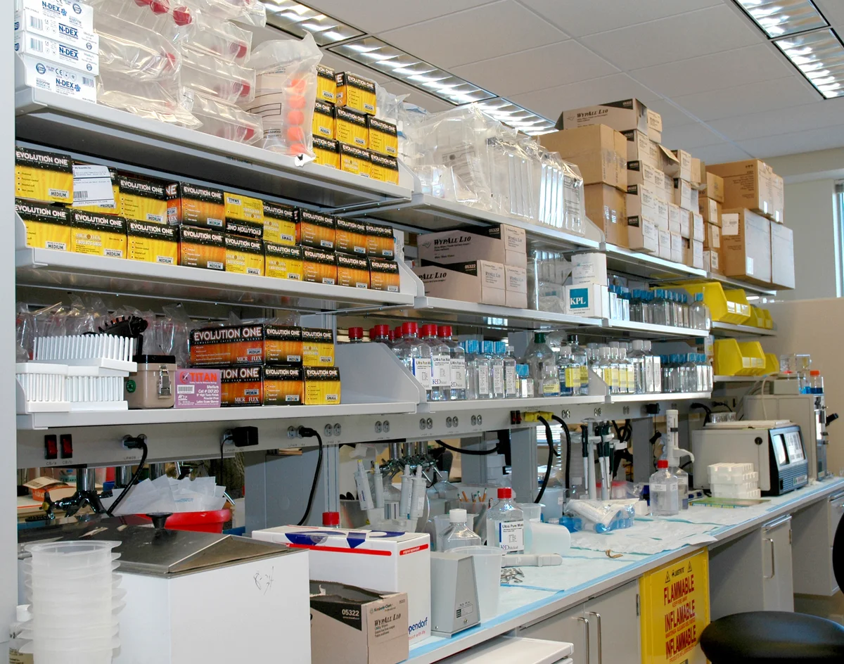 Laboratory benches with racks, glassware and sample-processing equipment at the NIH Clinical Research Center.